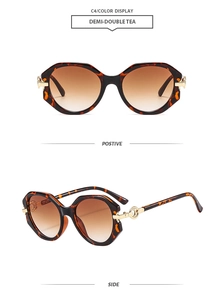 Detail view of round tortoise sunglasses with brown gradient lenses and gold accents