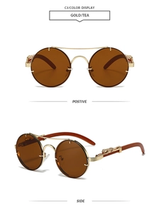 Detail of retro round gold metal sunglasses with leopard relief and brown lenses