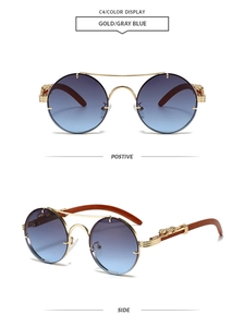 Detail of vintage round sunglasses with gold leopard relief and gradient blue lenses
