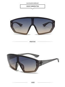 Detail view of large geometric gradient sunglasses with silver rivets and grey frames
