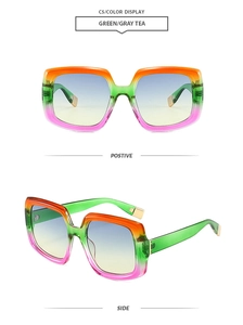 Dettaglio degli occhiali da sole squadrati oversize con montatura e lenti sfumate verde e grigio