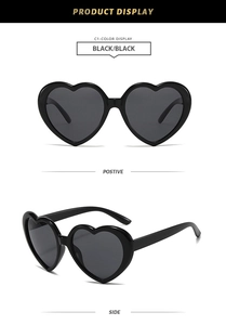 Front and side view of classic black heart shaped sunglasses with dark lenses