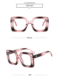 Detail view of pink gray gradient square frames with HD metal logo and polished finish