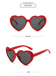 Front and side view of red heart-shaped sunglasses with dark lenses and glossy finish