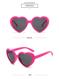 Detailed views of bright pink heart-shaped sunglasses with dark tinted lenses