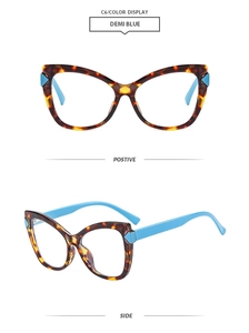 Detail of tortoise shell cat-eye glasses frame with contrasting light blue spring hinges