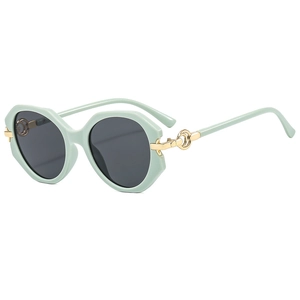 Retro mint green oversized round sunglasses with dark lenses and gold metal ring detail