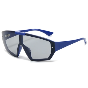 Bright blue oversized wrap-around sports sunglasses with dark gray lenses and side rivets