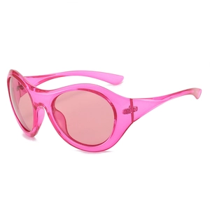 Y2K style futuristic oval sunglasses in transparent candy pink resin for women and men