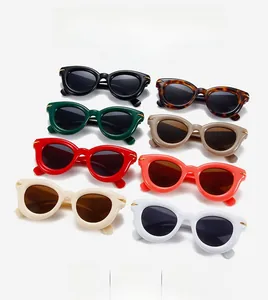 Chic oval puff sunglasses in eight colors with golden metal accents on temple hinges