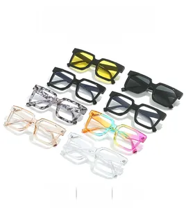 Multiple pairs of retro square sunglasses in various colors displayed on a white surface