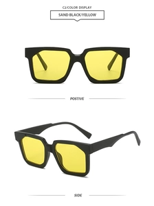 Detail of square frame sunglasses in matte sand black with yellow lenses