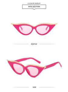Detail of rose red cat-eye sunglasses with gold metal trim and pink lenses