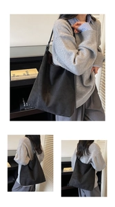 Close-up of minimalist black suede tote bag showing large capacity and soft texture details