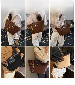 Multiple views of large tote bags with suede stitching, metal chains and tassels