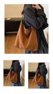 Close-up of brown suede tote bag showing soft matte texture and wide shoulder strap