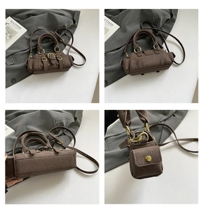 Detail view of vintage dark brown suede handbag with side pockets and metallic buckle strap