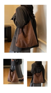 Detail view of large brown suede tote bag with leather straps for autumn fashion