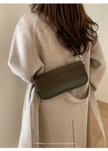 Rear view of model wearing a retro two-tone crossbody bag with beige wool coat