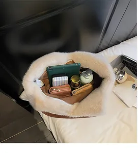 Interior view of large capacity plush tote bag showing storage for tablet and cosmetics