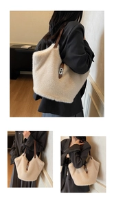 Detail view of large plush tote bag with cream faux fur and brown leather straps