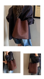 Detail of brown faux suede bucket bag featuring contrast dark brown braided shoulder straps