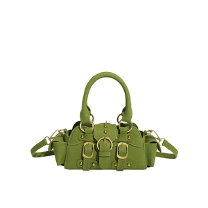 Green vintage motorcycle style tote bag with gold hardware and studded details
