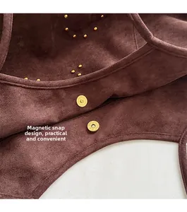Detail of high-quality brown suede tote showing magnetic closure and gold rivet hardware