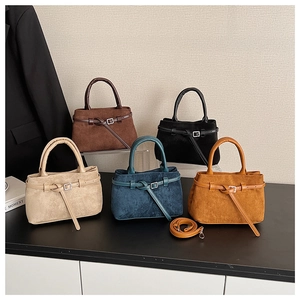 Frosted suede bucket bags shown in brown, black, beige, navy, and yellow with strap detail