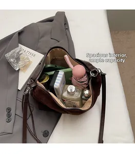 Detail view of large leopard print tote bag interior showing ample space for daily items