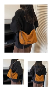 Detail of vintage brown suede tote bag featuring unique woven strap and metal hardware