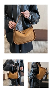Detail of vintage brown suede hobo bag featuring matte texture and leather trim finish
