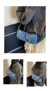 Detail of light blue denim shoulder bag with dual front pockets and vintage metal hardware