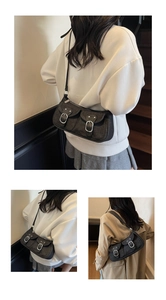 Detail of vintage denim shoulder bag featuring double front pockets and silver buckles