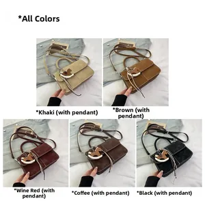 Detail view of five textured crossbody bags with decorative horse pendant in various colors