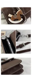 Detail view of brown vintage satchel with contrast stitching and wooden horse charm