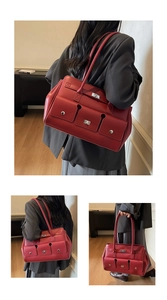 Detailed close-up of dark red leather tote bag showing multiple silver twist lock pockets