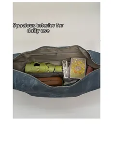 Top view of large blue tote bag interior showing spacious storage with zipper pocket