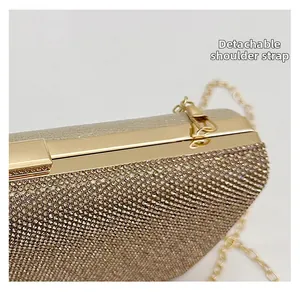 Macro view of detachable golden chain strap and rhinestone texture on evening bag