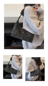 Detail of black suede hobo bag with adjustable strap and silver buckle minimalist style