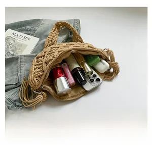 Internal storage view of bohemian hand-woven crossbody bag with fringe details