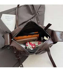 Macro view of the spacious inner compartment of the brown leather vintage biker tote bag