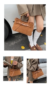 Detail of caramel suede square bag showing buckle strap, dual handles and shoulder strap