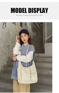 Detail of durable canvas tote with functional front pockets on minimalist shoulder bag