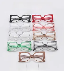 Flat lay display of large square cat-eye glasses frames in nine assorted trendy colors