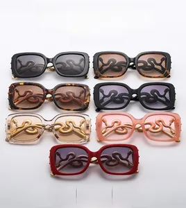 Detailed macro view of seven fashionable square sunglasses with unique golden snake-shaped temples