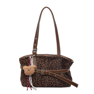 Retro leopard print tote bag with brown leather straps and a plush bear pendant
