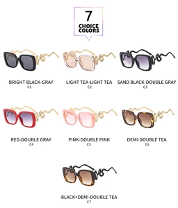 Matrix display of oversized sunglasses with snake-shaped temples in seven color options