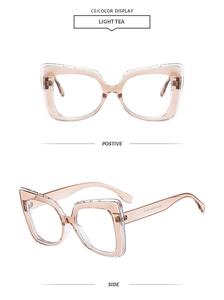 Detailed macro view of light tea square eyeglasses frame with dual-layer resin and metal hinges
