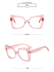 Detail view of pink cat-eye glasses frame with CE certification and model specs